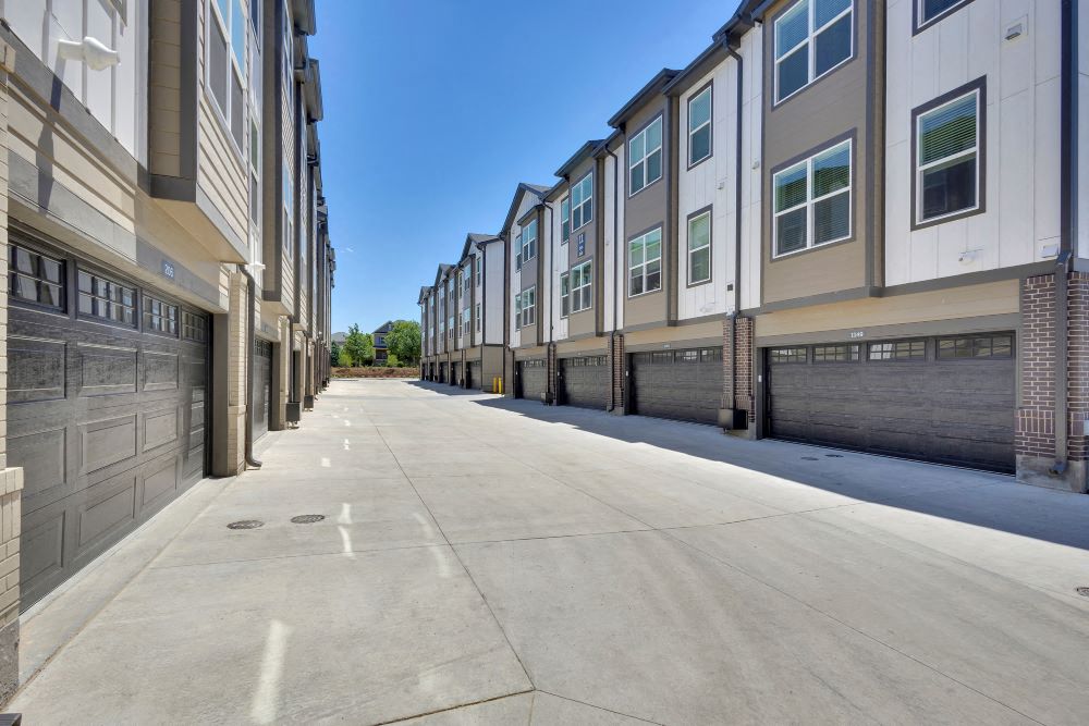 Alley view of townhome garages